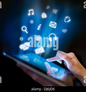 Hand touching digital tablet, social media concept Stock Photo