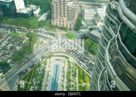 Crossroads below the Petronas Towers, Kuala Lumpur, Mayalasia. Stock Photo