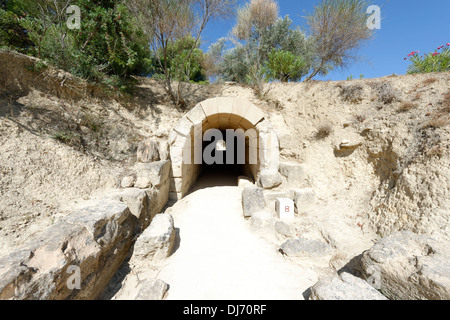 Arched limestone vaulted competitors entrance tunnel to the ancient stadium at Nemea Peloponnese Greece. Built in 320 BC, the tu Stock Photo