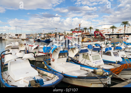 Small fishing boats moored in the Spanish port of La Caleta De Velez Stock Photo