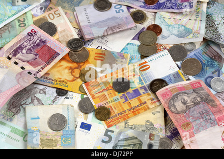 Many banknotes and coins like Euro, Dollar, Swiss Franc, Pound and Rubel Stock Photo