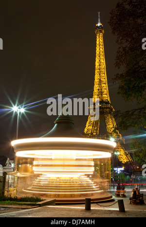 A moving Carousel near the Eiffel Tower in Paris. Stock Photo