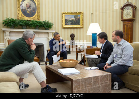 US President Barack Obama meets in the Oval Office with Chief of Staff Denis McDonough, and Deputy National Security Advisors Tony Blinken and Ben Rhodes to discuss negotiations with Iran November 23, 2013 in Washington, DC. A historic deal was struck between Iran and six world powers over Iran's nuclear program ending a decades-long standoff over the country's nuclear intentions. Stock Photo