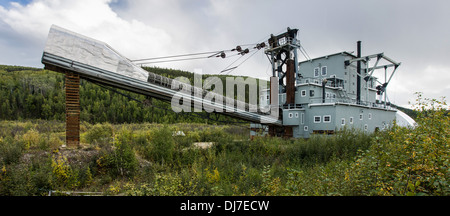 A restored mining dredge that used to work the gold fields around Dawson City, Yukon Stock Photo