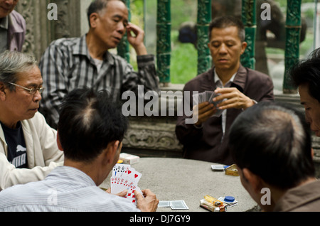 Chinese men playing cards in Zumiao ancestral temple ,Foshan ,China Stock Photo