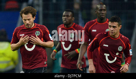 Hamburg, Germany. 24th Nov, 2013. Hanover's Szabolcs Huszti (L) celebrates his 0-1 goal with Mame Diouf, Salif Sane (2-R) and Manuel Schmiedebach (R) during the German Bundesliga match between Hamburger SV and Hannover 96 at Imtech Arena in Hamburg, Germany, 24 November 2013. Photo: PETER STEFFEN (ATTENTION: Due to the accreditation guidelines, the DFL only permits the publication and utilisation of up to 15 pictures per match on the internet and in online media during the match.)/dpa/Alamy Live News Stock Photo