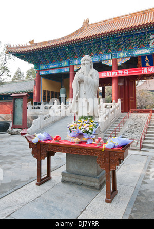 statue of Confucius in front of Dacheng Gate in The Temple of Confucius at Guozijian Street in Beijing, China Stock Photo