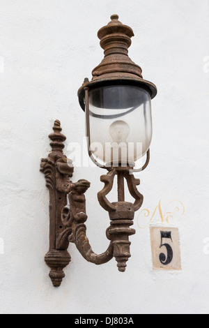 Old ornamental light on bracket with house number, Teguise, Lanzarote, Canary Islands, Spain Stock Photo