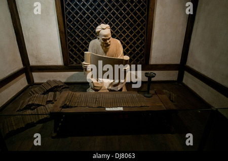 Confucius reading Book of Changes statue in The Temple of Confucius at Guozijian Street in Beijing, China Stock Photo