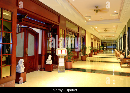 The entrance in restaurant and interior of luxury hotel with working ventilators, Ajman, UAE Stock Photo