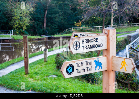 Sign for the Taff Trail and the Brinmore Tramroad by the side of the Monmouthshire and Brecon Canal. Stock Photo