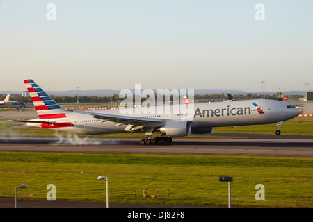 American Airlines Boeing 777 in new colours landing at London Heathrow Airport Stock Photo