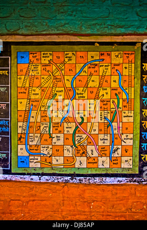 Snakes and ladders numbers game painted on a wall Stock Photo