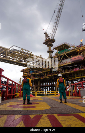 vessel able seaman or marine crew working on deck for platform crew transfer using safety basket Stock Photo