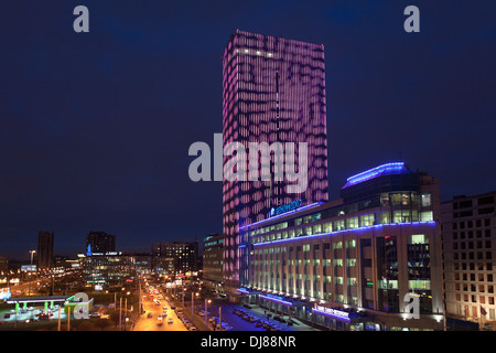 Night view of illuminated building business center tower on the Constitution Square, next to Lenenergo. St. Petersburg, Russia