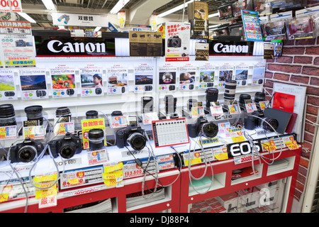 Showcase large Japanese store Bic Camera Inc. with cameras and lenses for Canon on circa April 2013 in Tokyo, Japan. Stock Photo