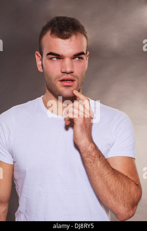 Thoughtful man planning and scheming Stock Photo