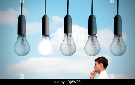 Thoughtful young businessman looking away Stock Photo