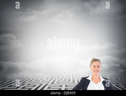 Blonde businesswoman standing with hands on hips Stock Photo