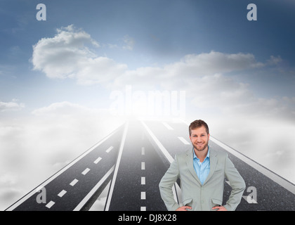 Stylish man smiling with hands on hips Stock Photo