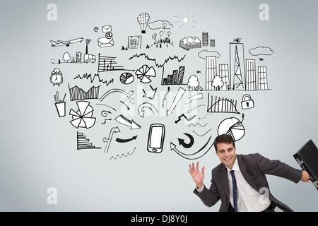 Happy businessman holding a briefcase and running Stock Photo
