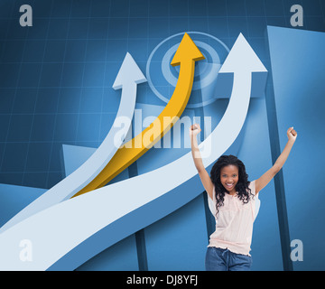 Happy woman with her arms raised up in front of arrows and statistic Stock Photo