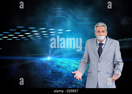 Composite image of businessman gagged with adhesive tape on mouth Stock Photo