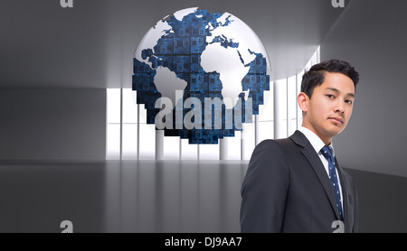 Composite image of digital globe on grey abstract background Stock Photo