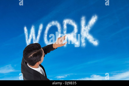 Composite image of asian businessman pointing Stock Photo