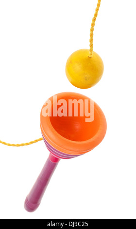 wooden Cup-and-ball (ball in cup) toy close up isolated on white background Stock Photo