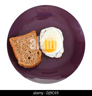 top view of fried egg and toasted rye bread on plate isolated on white background Stock Photo