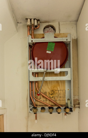 Gas boiler installation in progress, all the connections are ready and are taped up to prevent any debris from entering, UK Stock Photo