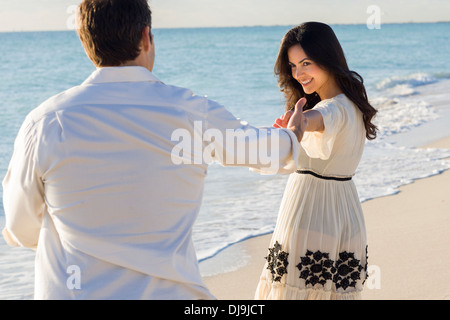 Couple dancing on beach Stock Photo