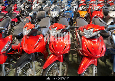 Motorcycle motorbike showroom showing all the range of scooters on sale in Korat, Thailand Stock Photo