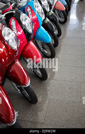 Motorcycle motorbike showroom showing all the range of scooters on sale in Korat, Thailand Stock Photo