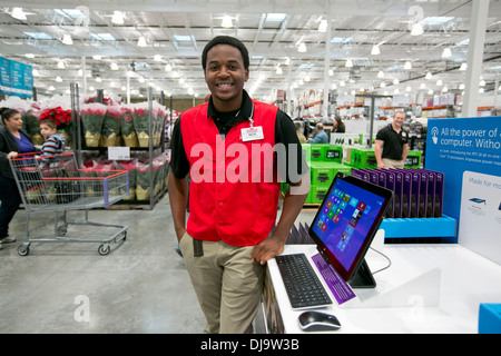 Young African-American male COSTCO employee smiles at new store in Cedar Park, Texas Stock Photo
