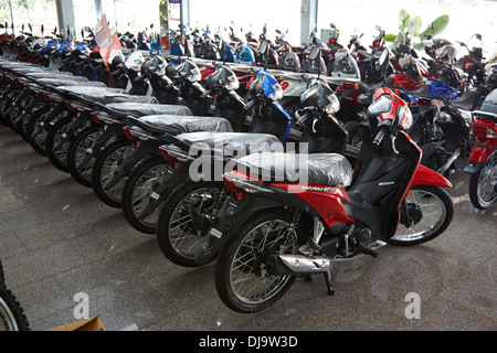 Motorcycle motorbike showroom showing all the range of scooters on sale in Korat, Thailand Stock Photo