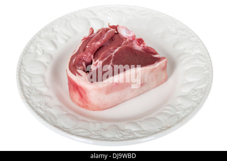 Fresh Tasty Lean Raw Uncooked Lamb Chops Ready To Cook On A Plate Isolated Against A White Background With No People And A Clipping Path Stock Photo