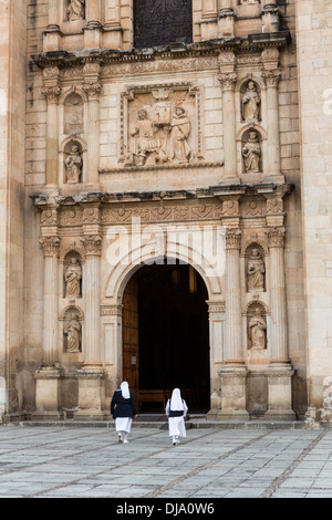 Nuns walk into the Church of Santo Domingo de Guzmán October 31, 2013 in Oaxaca, Mexico. Stock Photo