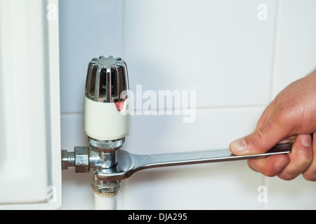 Close up of hand holding a wrench Stock Photo