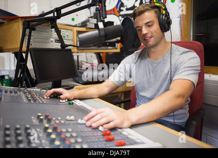 Handsome happy radio host moderating Stock Photo