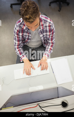 Handsome focused student working on computer Stock Photo