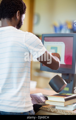 Librarian Scanning Books At Library Counter Stock Photo