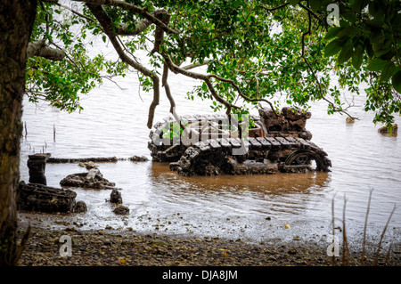 Rusting, abandoned World War II military hardware, left for many years after being dumped in the sea Stock Photo