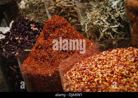 Exotic spices and herbs lined up for sale at Deira Spice Market. Dubai, United Arab Emirates. Stock Photo