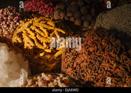 Exotic spices and herbs lined up for sale at Deira Spice Market. Dubai, United Arab Emirates. Stock Photo