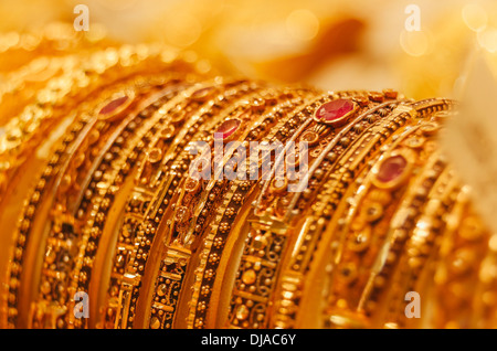 Jewelry for display behind the storefront of a shop in Deira Gold Souk. Dubai, United Arab Emirates. Stock Photo