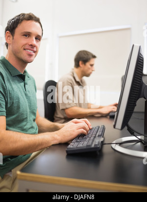 Mature students in computer room Stock Photo