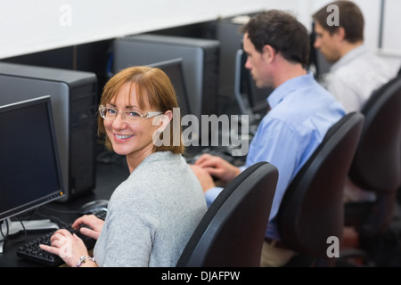 Mature students in the computer room Stock Photo