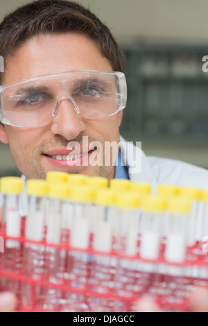 Male researcher  with at test tubes in the lab Stock Photo